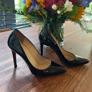 Used Christian Louboutin black pumps